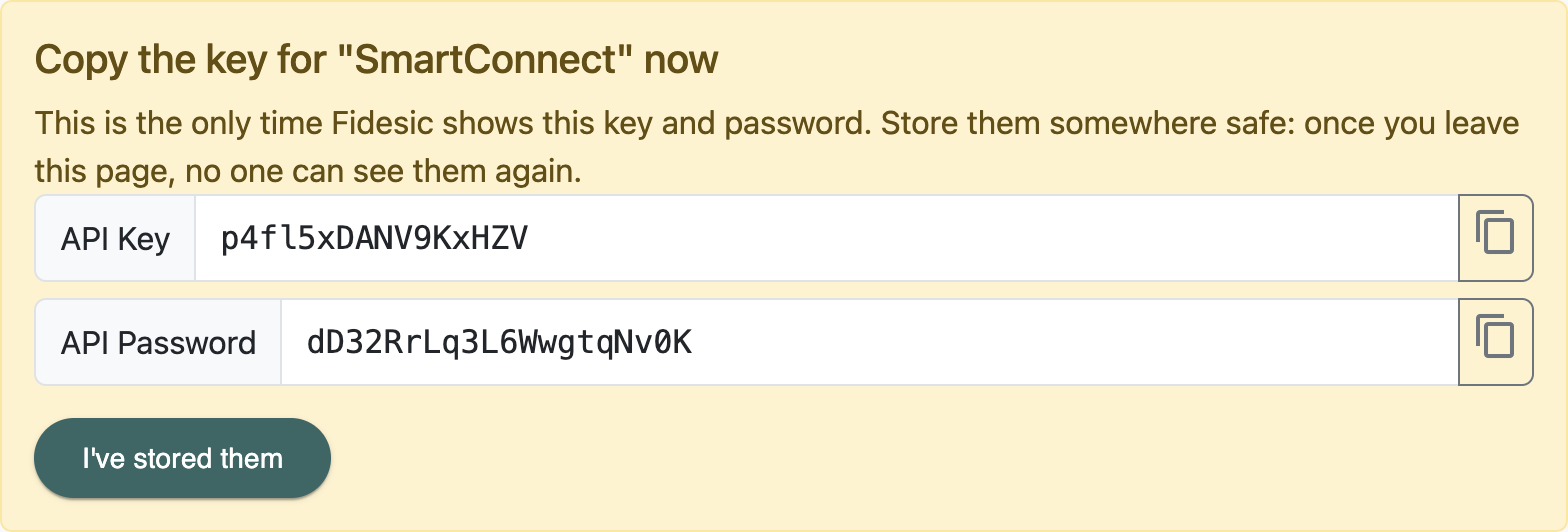 The screen that shows a new API key and password once, with the copy buttons